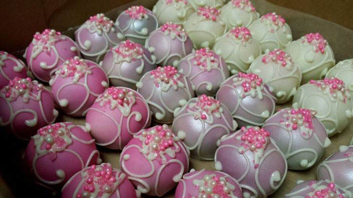 Pink, lavender, and mint green cake pops.